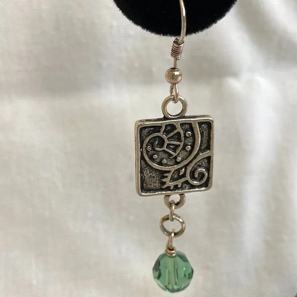 NWOT Beach inspired nautilus silver earrings with green swarovski crystal drop.